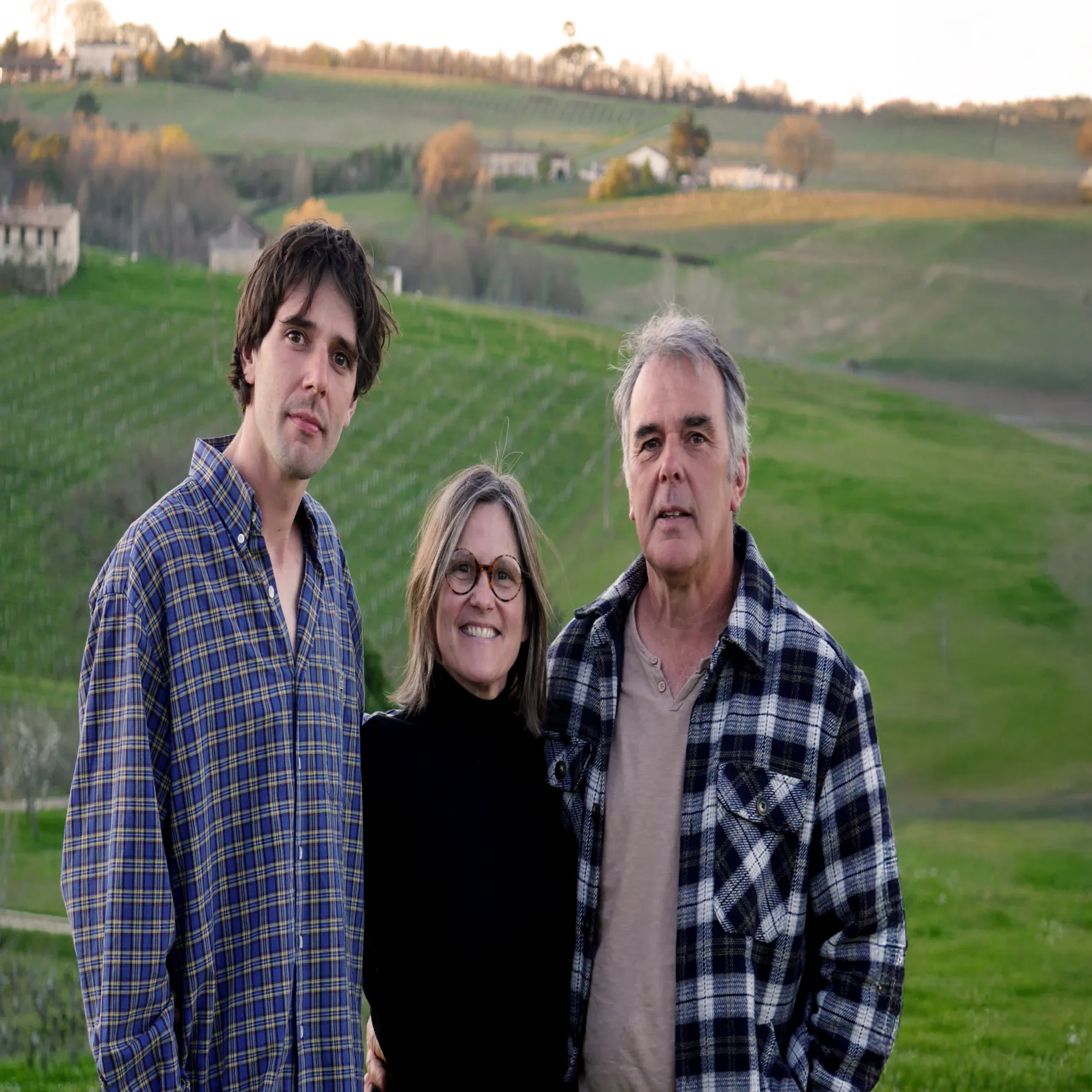 The Bassereau family standing among the vines at Château de la Grave